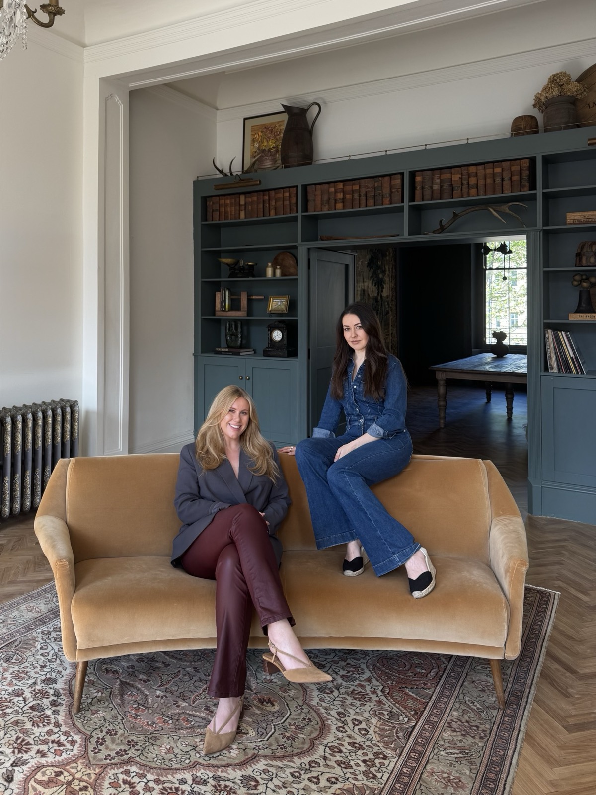 Jelena and Sarah seated in a period interior